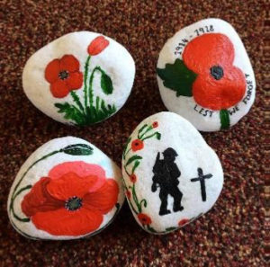 Stones painted with poppies